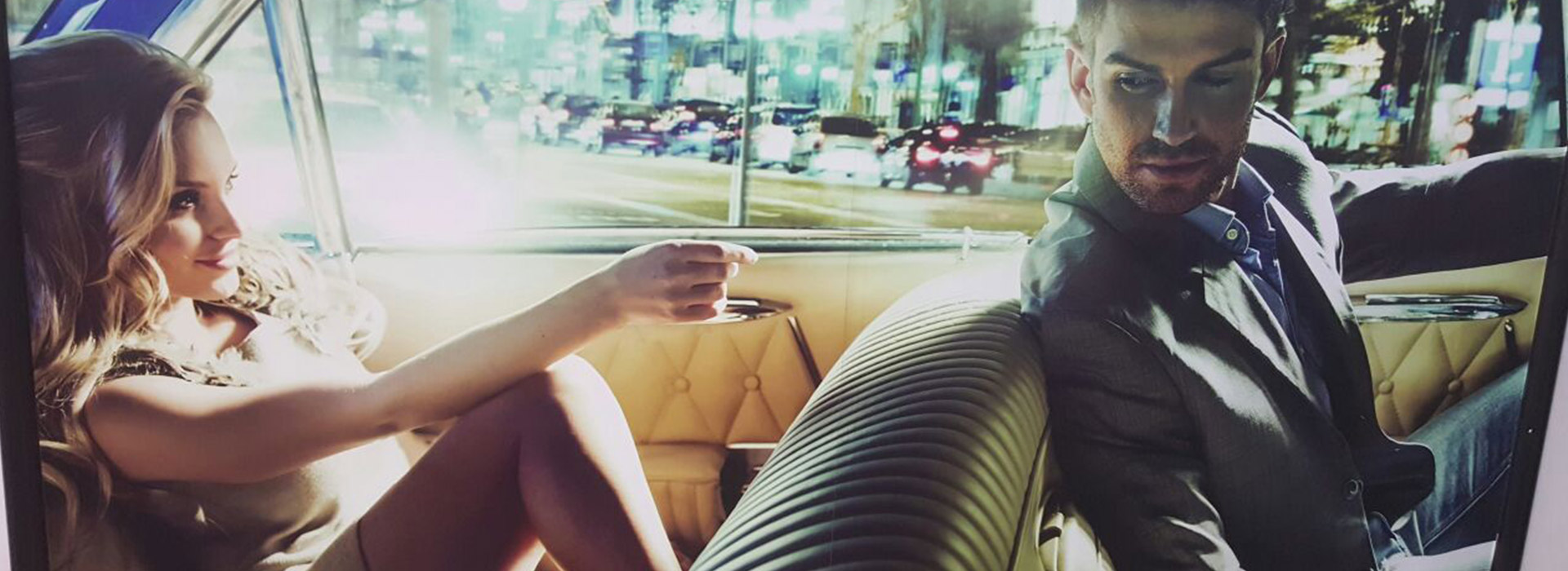 Couple in a luxury car. Classique by Rajiv bespoke style